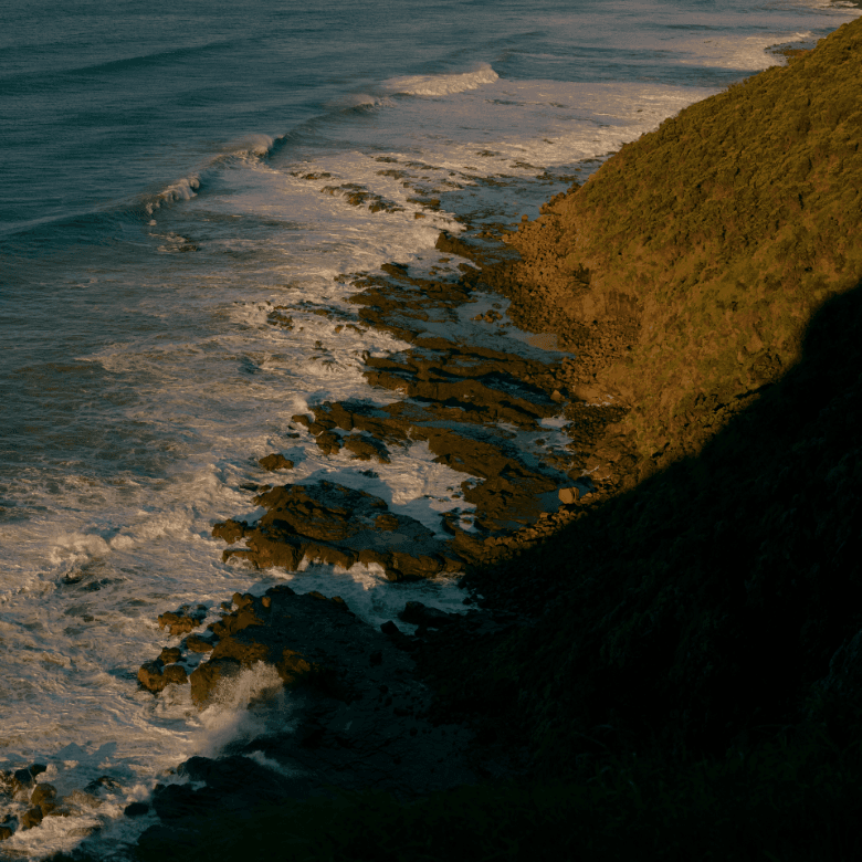 Rugged beach coastline with rocks and waves
